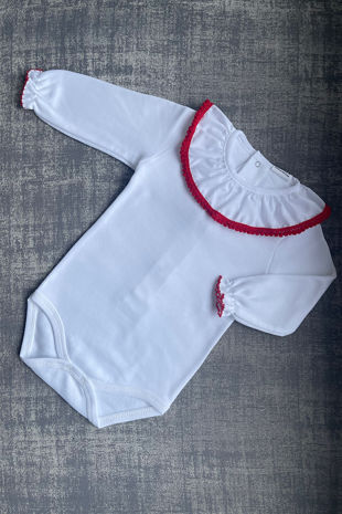 White vest with red pom pom trim